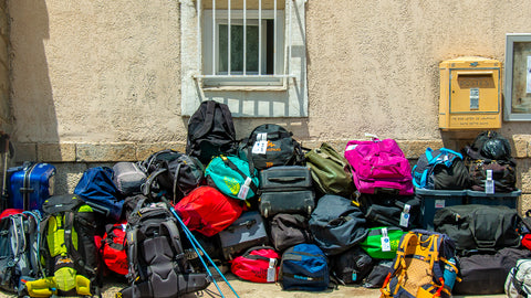 A pile of backpacks and nags on the Tour du Mont Blanc