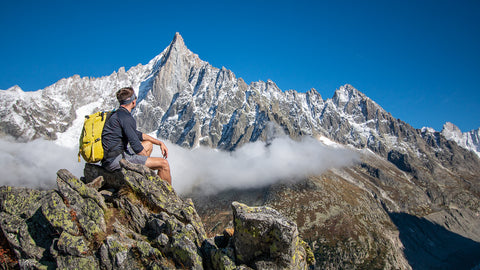 Hiker overlooking Les Drus above Mer de Glace from Signal Forbes near Chamonix