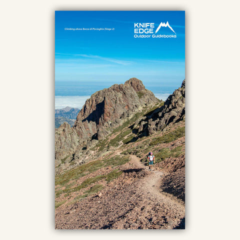 A hiker climbing to the col on Stage 1 of the GR20 in  in Knife Edge Outdoors Guidebook to the Corsica GR20